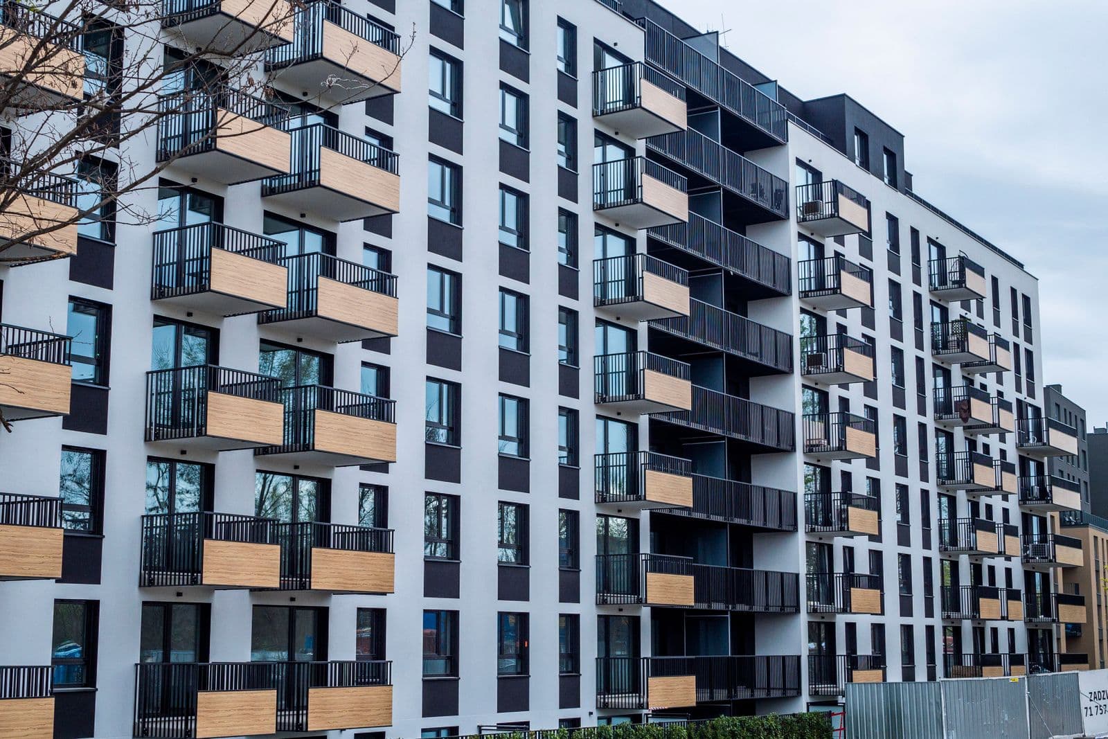 Sleek high-rise apartment building with geometric architecture